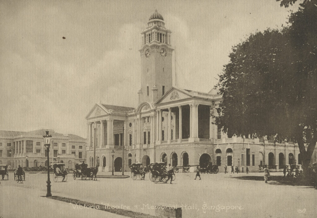 Below the Clock Tower, between Victoria Theatre and Memorial Hall/Victoria Concert Hall – Empress Place